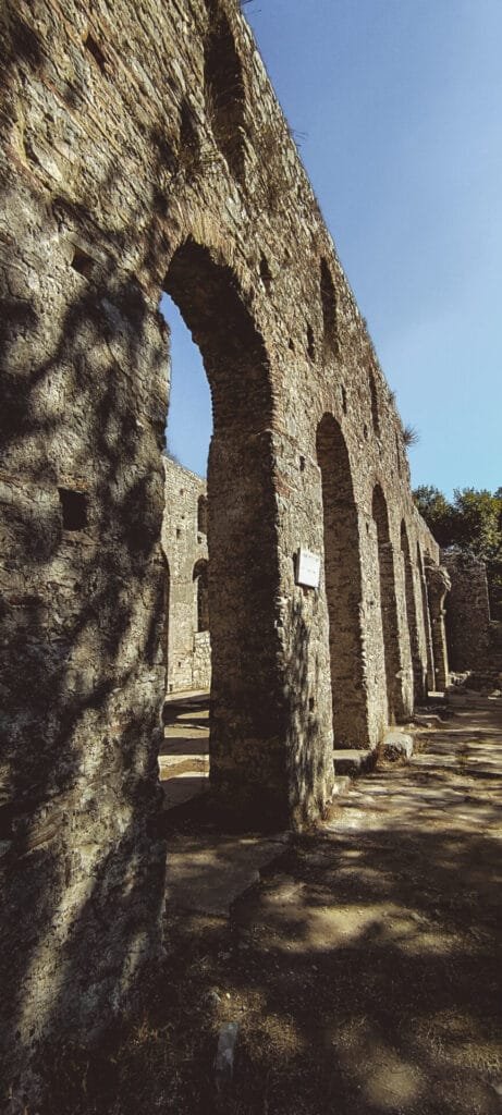 Exterior of the Basilica in Butrint, Albania, with ancient columns and ruins